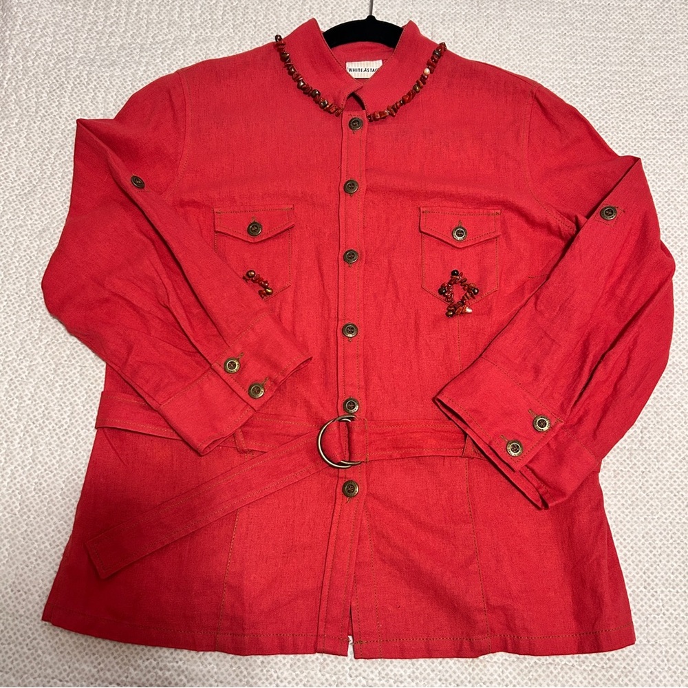 coral button-down shirt with a belted waist and beaded accents